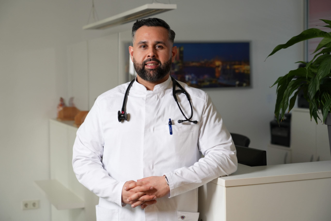 A doctor in his proper attire and with stethoscope